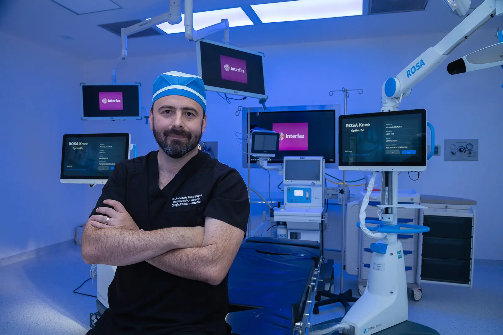 Dr. Andrés Acosta in an operating room equipped with the ROSA robotic system